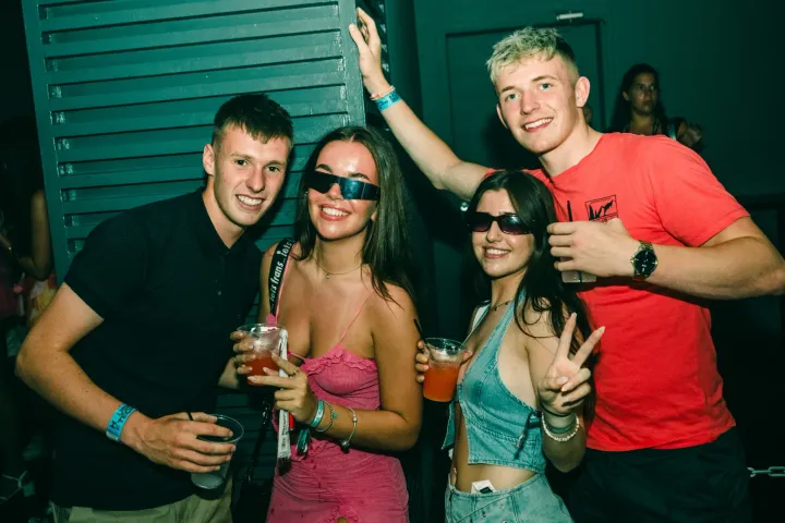 Two lads and two girls posing together at House of Tech in Kavos