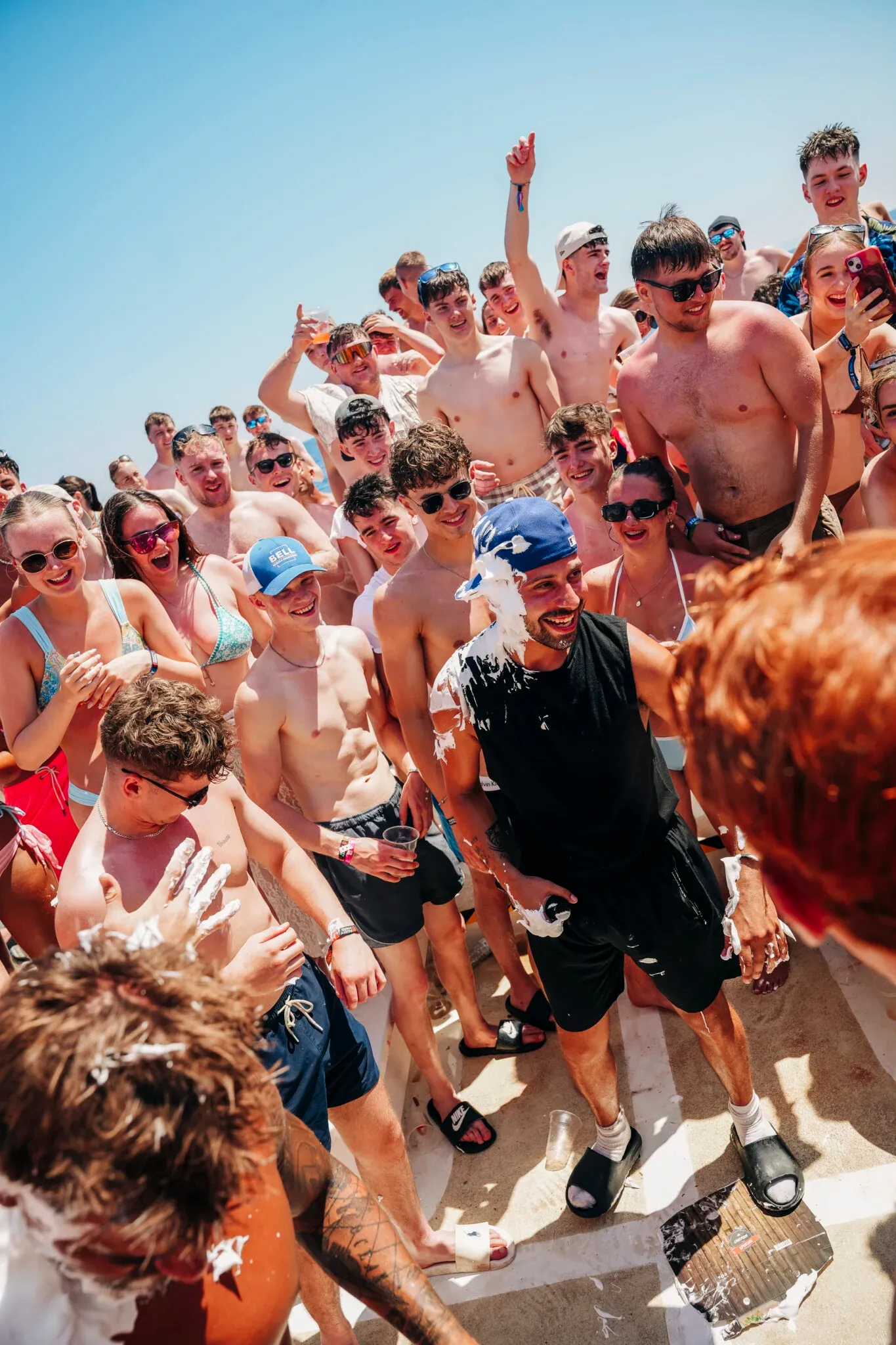 Lads and girls crack up on the Kavos Booze Cruise as a messy party game kicks off and the deck erupts in laughter