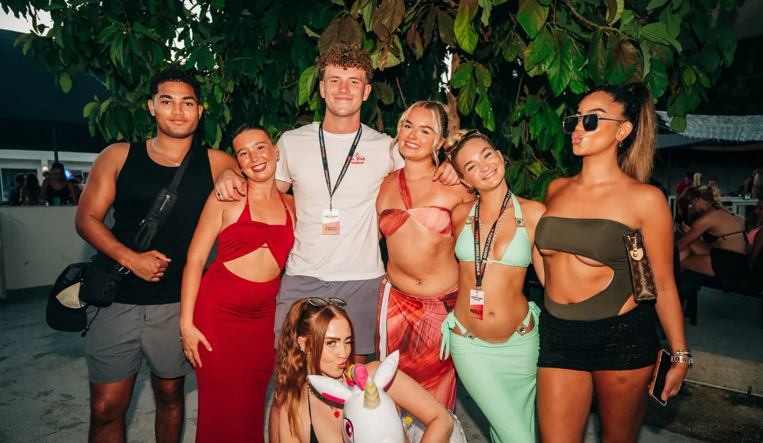 Lads and girls posing in Barcelona with two Party Hard Travel reps, all set for a huge day of sun, drinks and party vibes.