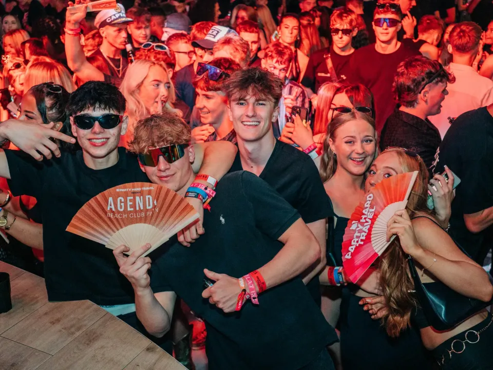 Lads and girls dressed in black posing together at Agenda Beach Club Party in Magaluf