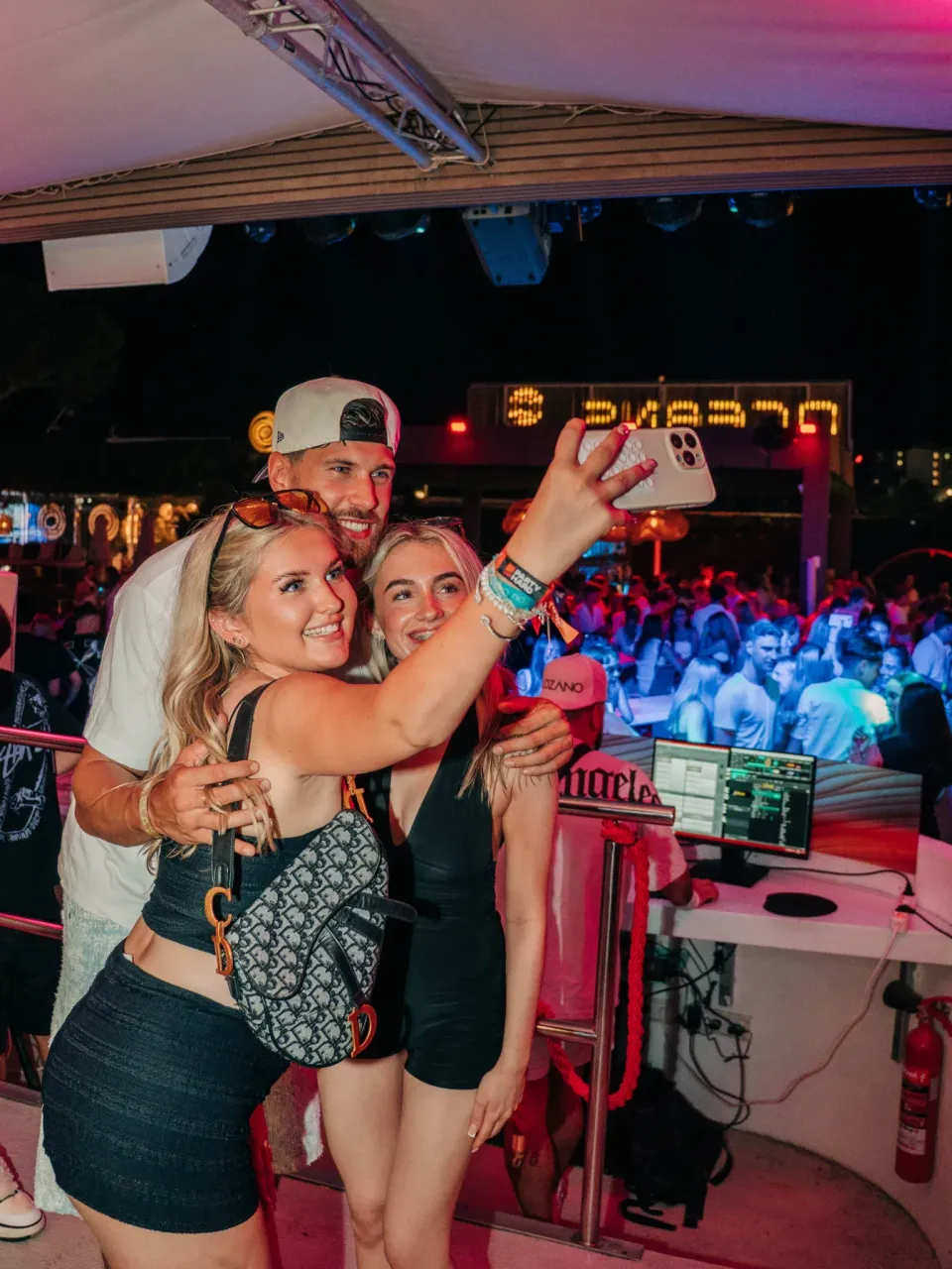 Two girls and a lad taking a selfie at Agenda Beach Club Party in Magaluf