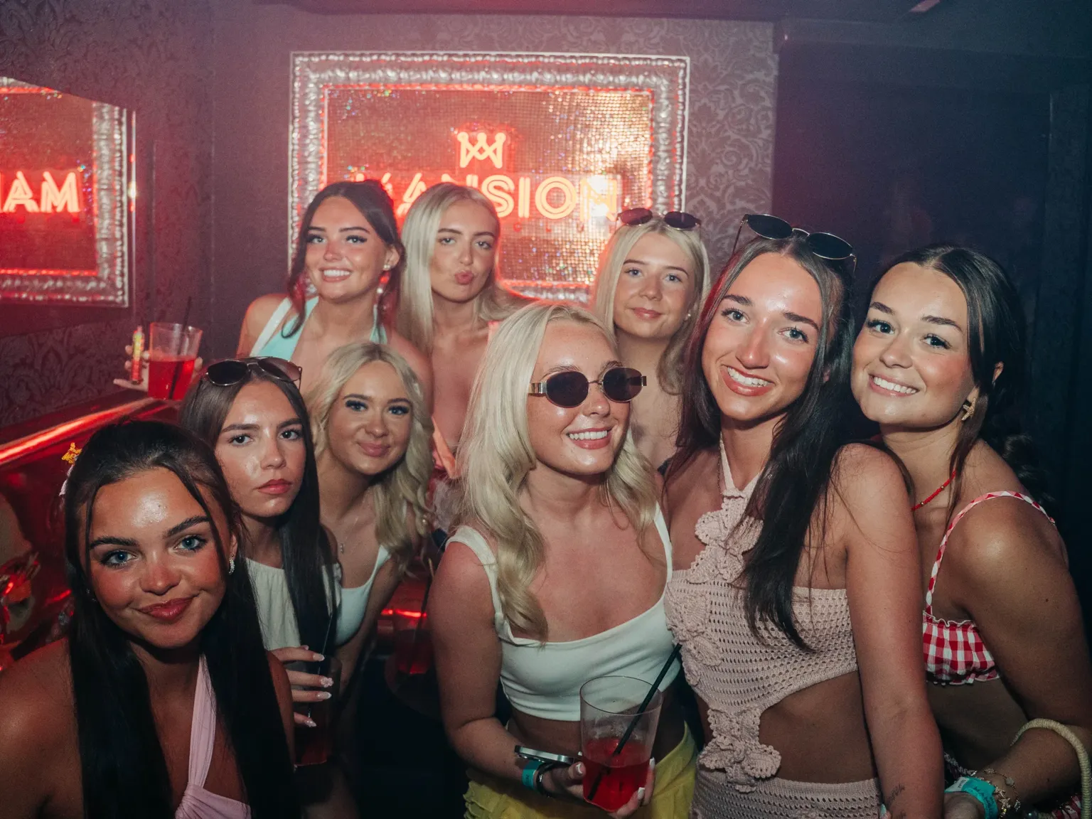 Group of girls posing together at Mansion Club Night in Magaluf