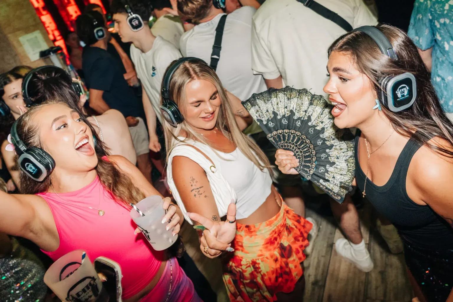 Girls posing together during at the Silent Disco Capital Bar in Magaluf