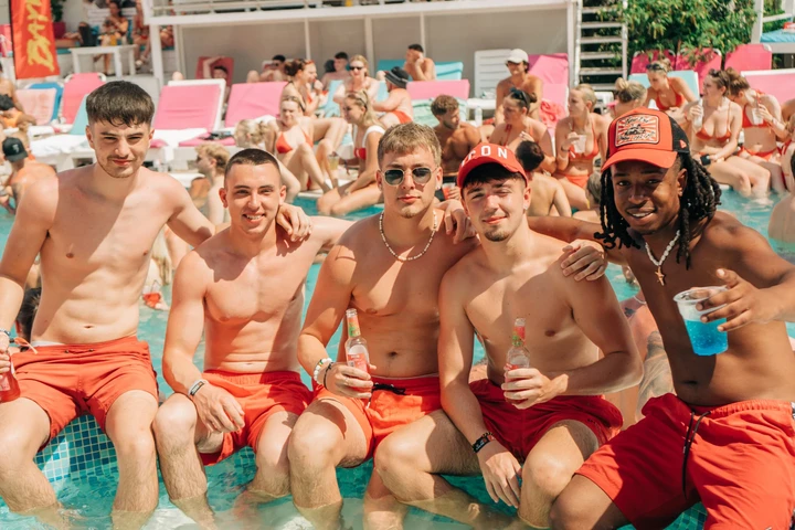 Baywatch Pool Party Kavos group of boys by the pool