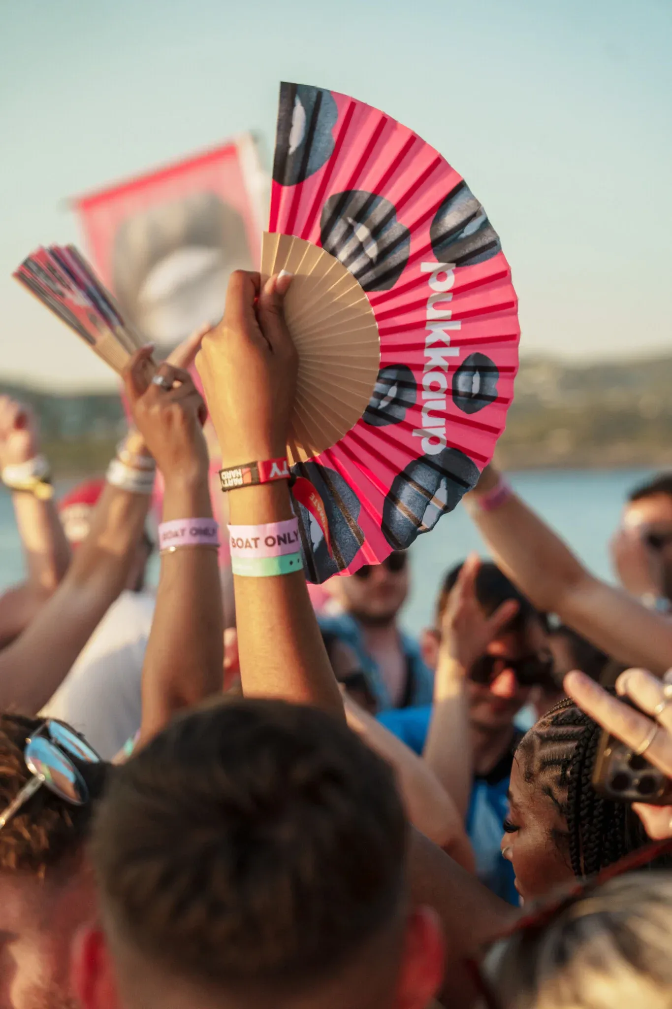 Partygoers dancing on board a Pukka Up boat party off the Ibiza coast