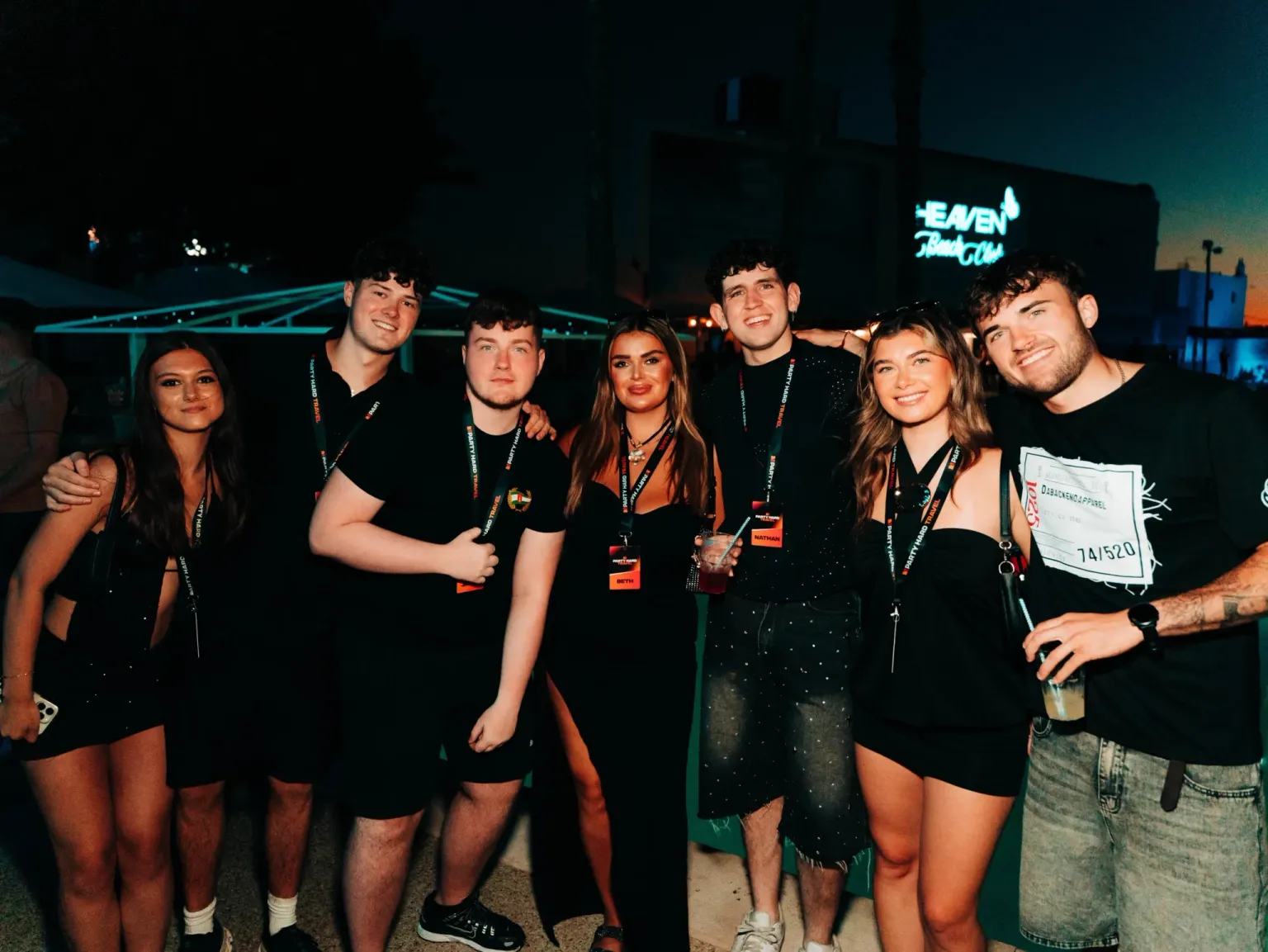 Party Hard Travel rep team posing together at a summer event