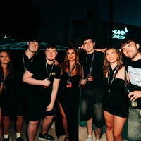 Party Hard Travel rep team posing together at a summer event