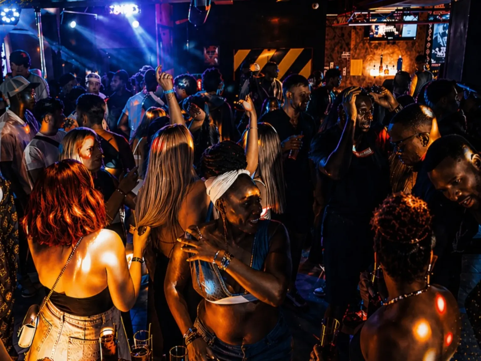 Soul City Ibiza Bar people dancing and vibing to music and dim lighting