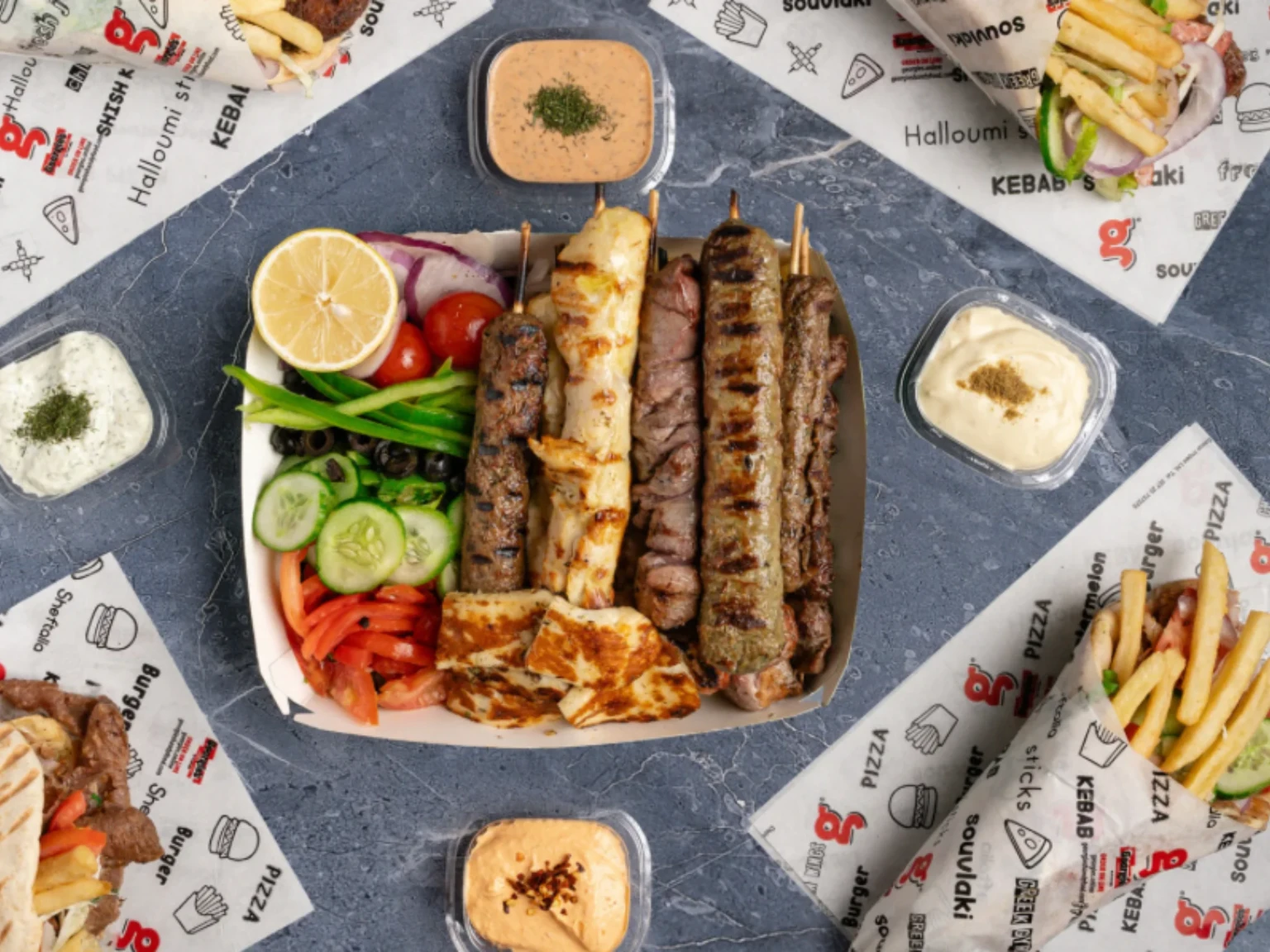 GEORGIE'S HANDY FOOD Birds Eye view of chips sauce and a gyros